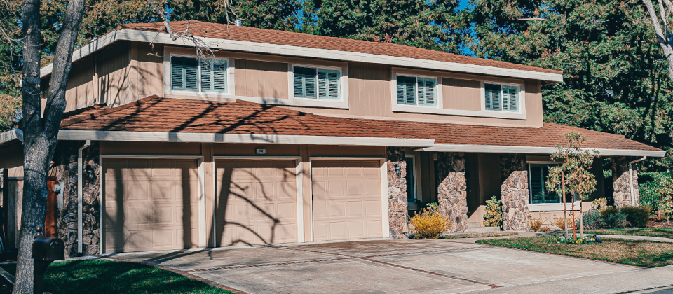 Two story home with three car garage.